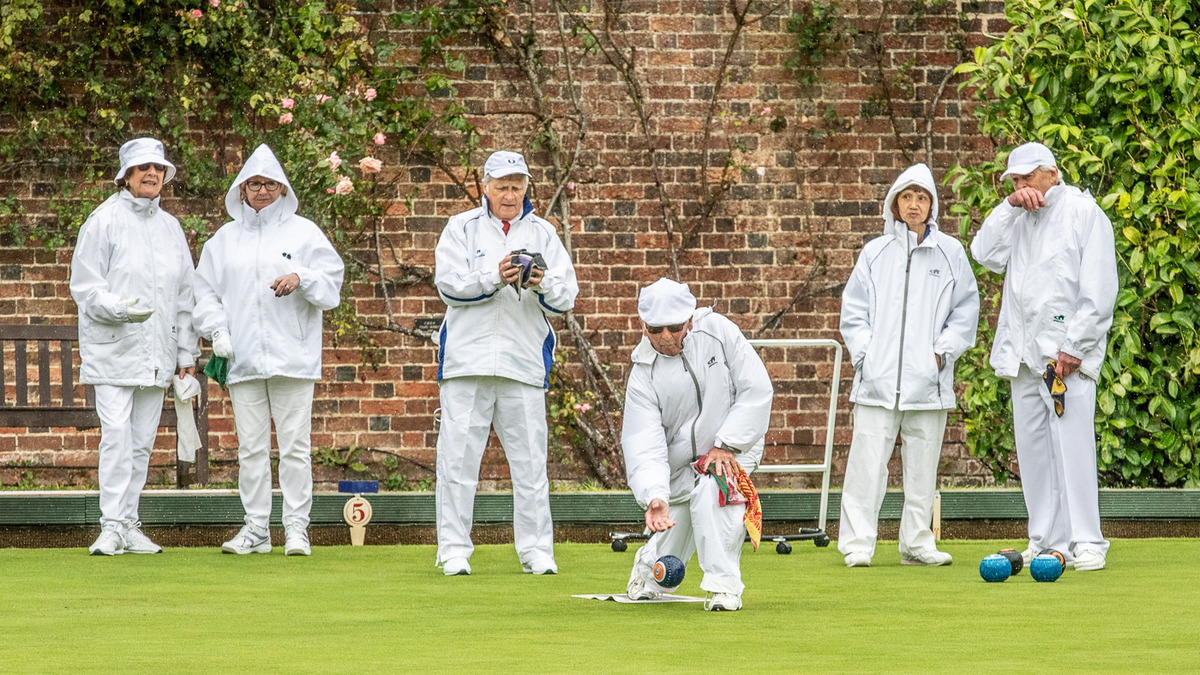 Peter Butler on the mat again with team mates Jean Barltrop and Peter Jennings looking on, behind right.